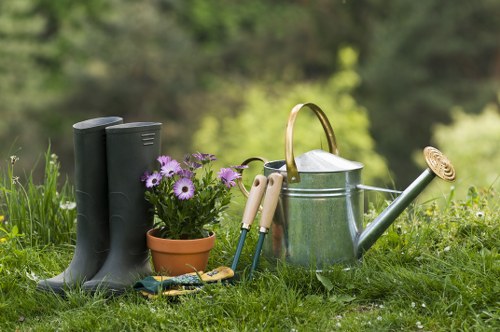 Landscaper carrying out safe outdoor work with tools and protective equipment